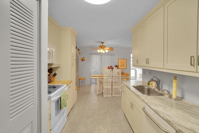 3477 Christopher St Unit 3477, West Palm Beach, FL 33417 - kitchen featuring white appliances, light countertops, a textured ceiling, ceiling fan, and cream cabinetry