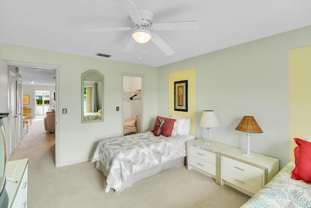 3477 Christopher St Unit 3477, West Palm Beach, FL 33417 - bedroom with light colored carpet, a ceiling fan, and a walk in closet