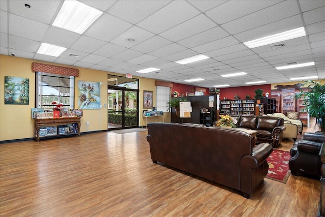 3477 Christopher St Unit 3477, West Palm Beach, FL 33417 - living area with light wood-style flooring and a drop ceiling