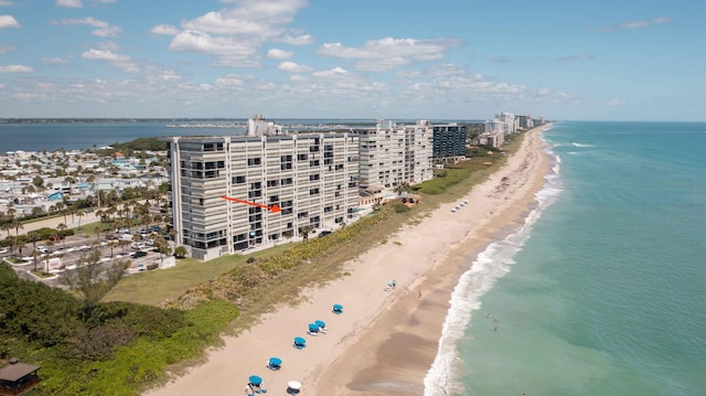 drone / aerial view of waterfront with a beach