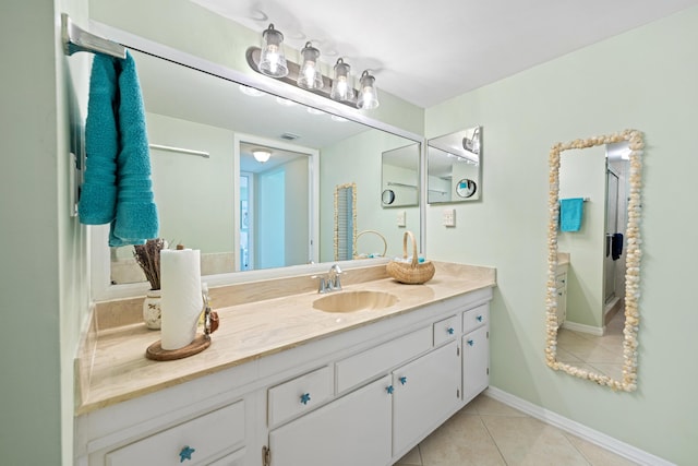 bathroom with tile patterned floors and vanity