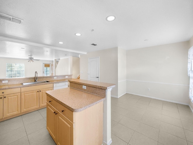 1898 SE Interlachen Dr, Port Saint Lucie, FL 34952 - kitchen with a sink, light brown cabinets, recessed lighting, light countertops, and ceiling fan