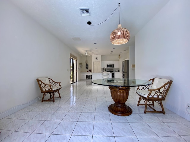 dining space featuring a ceiling fan