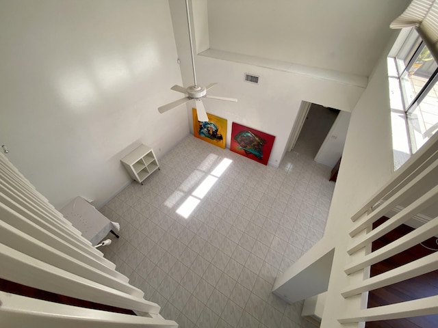 unfurnished living room featuring ceiling fan
