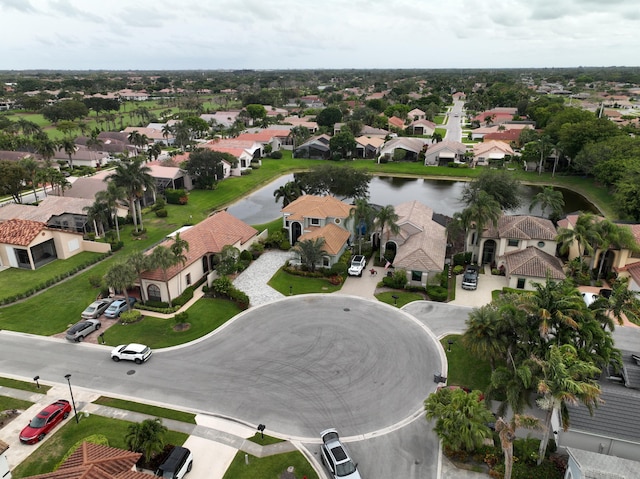 aerial perspective of suburban area with a nearby body of water