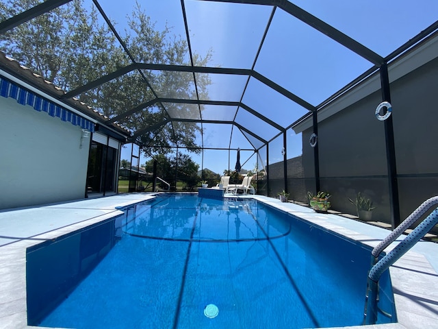 outdoor pool featuring a patio and a lanai
