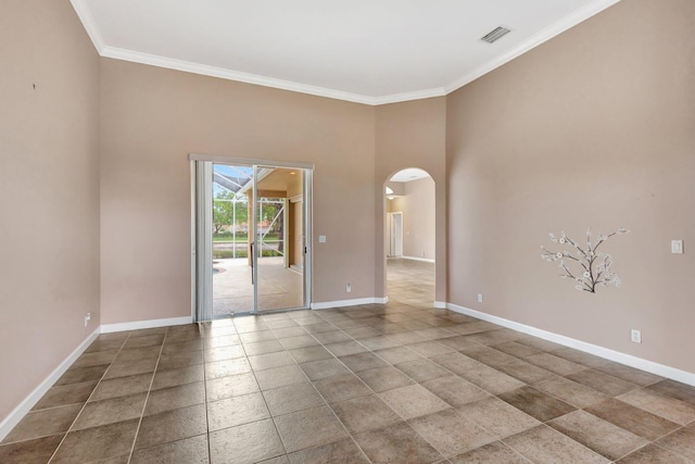 3588 Turtle Island Ct, West Palm Beach, FL 33411 - empty room featuring arched walkways, ornamental molding, baseboards, and a towering ceiling