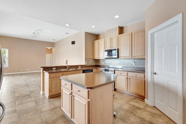 3588 Turtle Island Ct, West Palm Beach, FL 33411 - kitchen with appliances with stainless steel finishes, light brown cabinets, tasteful backsplash, a sink, and a peninsula
