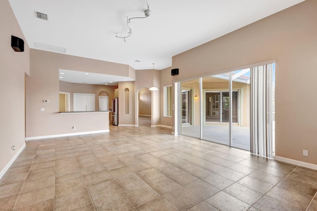 3588 Turtle Island Ct, West Palm Beach, FL 33411 - unfurnished living room featuring baseboards, arched walkways, and recessed lighting