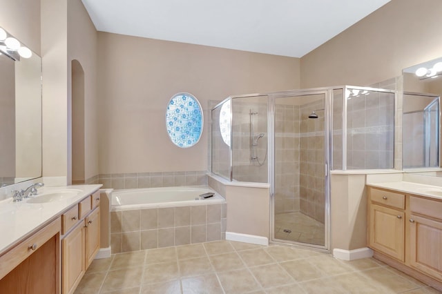 3588 Turtle Island Ct, West Palm Beach, FL 33411 - bathroom with a stall shower, tile patterned floors, a bath, and two vanities