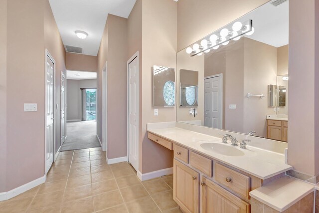 3588 Turtle Island Ct, West Palm Beach, FL 33411 - bathroom featuring baseboards, tile patterned floors, and vanity