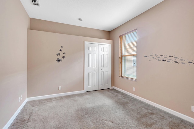 3588 Turtle Island Ct, West Palm Beach, FL 33411 - unfurnished bedroom featuring carpet floors, baseboards, and a closet