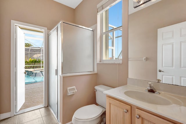 3588 Turtle Island Ct, West Palm Beach, FL 33411 - full bath featuring a stall shower, toilet, vanity, baseboards, and tile patterned flooring