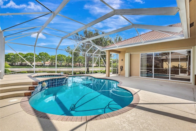 3588 Turtle Island Ct, West Palm Beach, FL 33411 - view of swimming pool featuring a patio area, a pool with connected hot tub, and glass enclosure