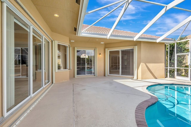 3588 Turtle Island Ct, West Palm Beach, FL 33411 - swimming pool featuring a patio area and glass enclosure