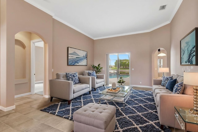 3588 Turtle Island Ct, West Palm Beach, FL 33411 - tiled living room featuring arched walkways, ornamental molding, and baseboards