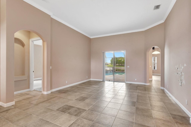 3588 Turtle Island Ct, West Palm Beach, FL 33411 - spare room with ornamental molding, arched walkways, baseboards, and light tile patterned flooring