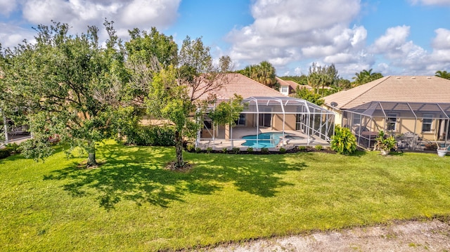 3588 Turtle Island Ct, West Palm Beach, FL 33411 - view of green lawn with an outdoor pool, a patio area, and a lanai