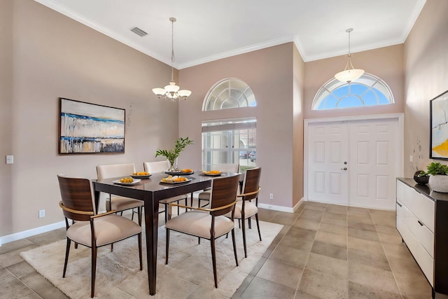 3588 Turtle Island Ct, West Palm Beach, FL 33411 - dining room with ornamental molding, baseboards, and a chandelier