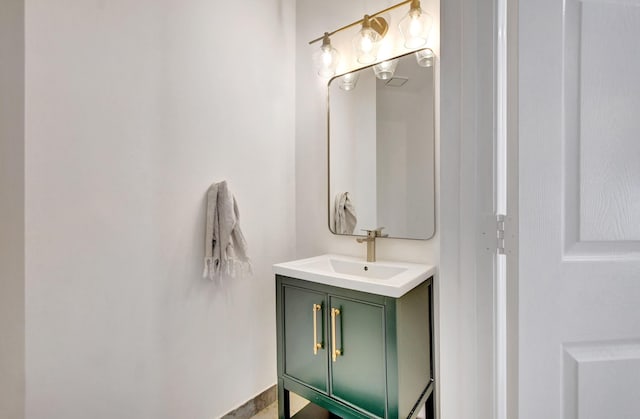 bathroom featuring vanity and baseboards