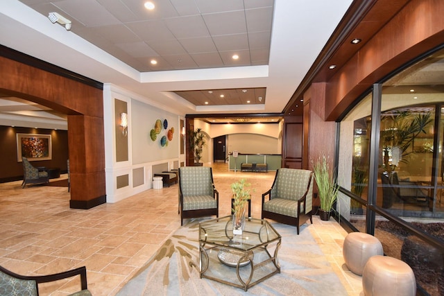 common area featuring a decorative wall, a wainscoted wall, and recessed lighting