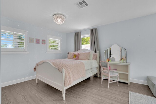 765 Lagoon Dr, North Palm Beach, FL 33408 - bedroom with wood finished floors and baseboards