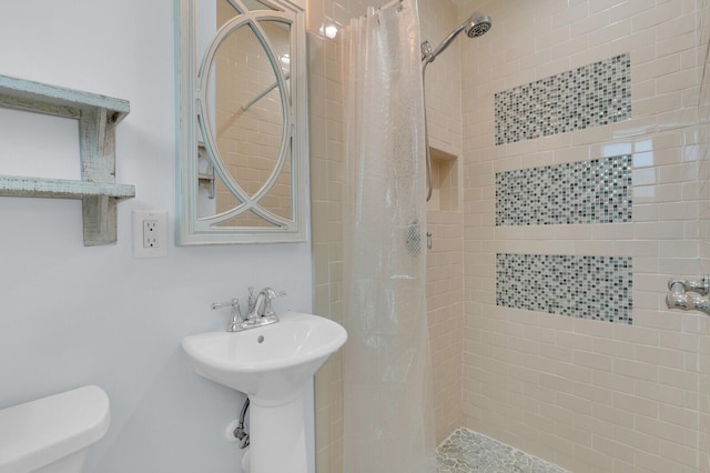 765 Lagoon Dr, North Palm Beach, FL 33408 - full bathroom featuring a stall shower and toilet