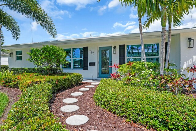 765 Lagoon Dr, North Palm Beach, FL 33408 - ranch-style home featuring stucco siding