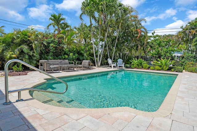765 Lagoon Dr, North Palm Beach, FL 33408 - view of pool with a patio area and an outdoor hangout area