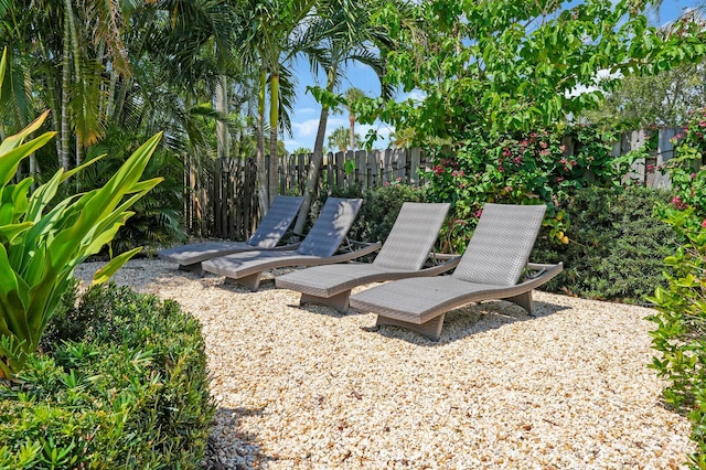 765 Lagoon Dr, North Palm Beach, FL 33408 - view of yard featuring fence and a patio