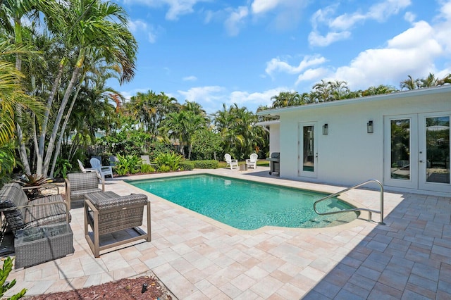 765 Lagoon Dr, North Palm Beach, FL 33408 - outdoor pool with a patio and french doors