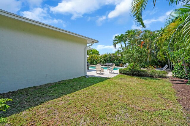 765 Lagoon Dr, North Palm Beach, FL 33408 - view of green lawn with an outdoor pool