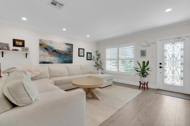 765 Lagoon Dr, North Palm Beach, FL 33408 - living area with wood finished floors, crown molding, recessed lighting, and baseboards
