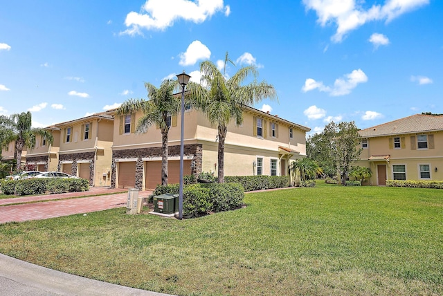 view of property exterior featuring stucco siding, a garage, a lawn, decorative driveway, and a residential view