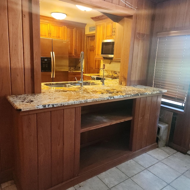 16761 130th Way N, Jupiter, FL 33478 - kitchen with stainless steel appliances, open shelves, light stone countertops, and light tile patterned floors