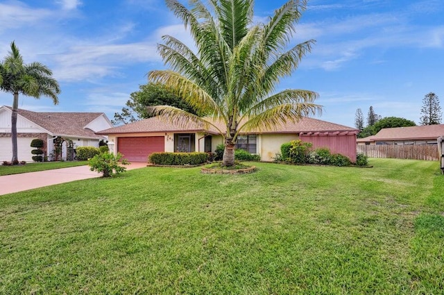 ranch-style home with concrete driveway and an attached garage