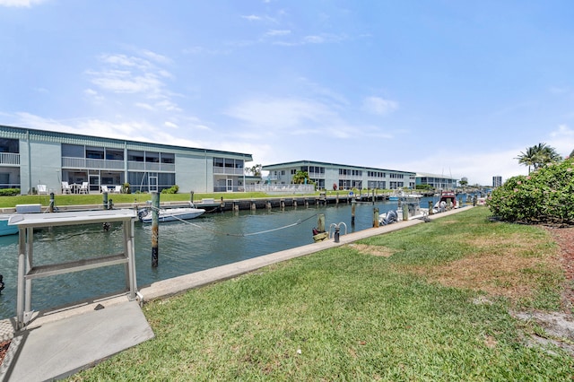 dock with a water view and a yard