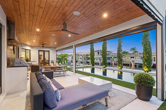160 Periwinkle Dr, Hypoluxo, FL 33462 - sunroom / solarium with a water view, a residential view, and french doors