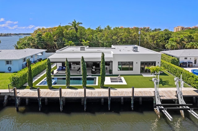 160 Periwinkle Dr, Hypoluxo, FL 33462 - back of house featuring a patio, an outdoor pool, boat lift, a water view, and a yard