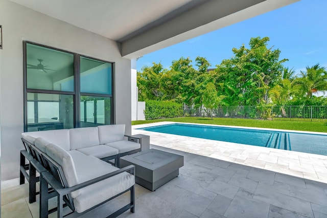 view of pool with outdoor lounge area, a patio, and a fenced backyard