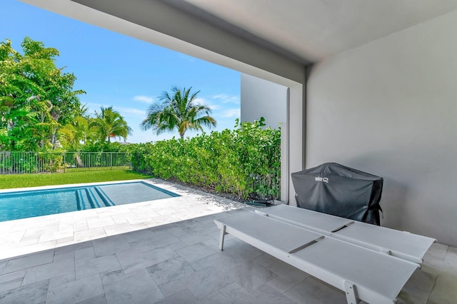 view of swimming pool featuring a fenced backyard and a patio area