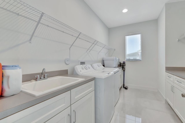 washroom featuring washer and dryer, cabinet space, baseboards, recessed lighting, and light tile patterned flooring