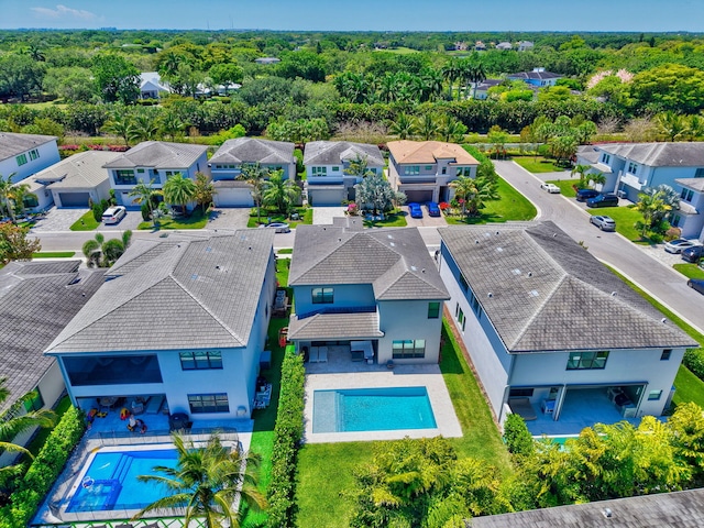 aerial view of residential area featuring a pool