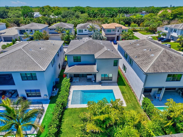 aerial view of residential area with a pool