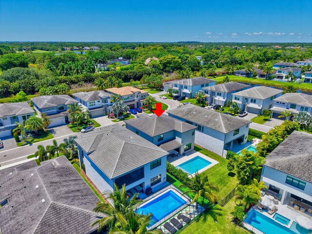 aerial view of residential area featuring a pool