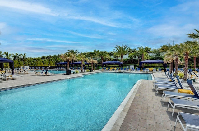 community pool featuring a gazebo and a patio