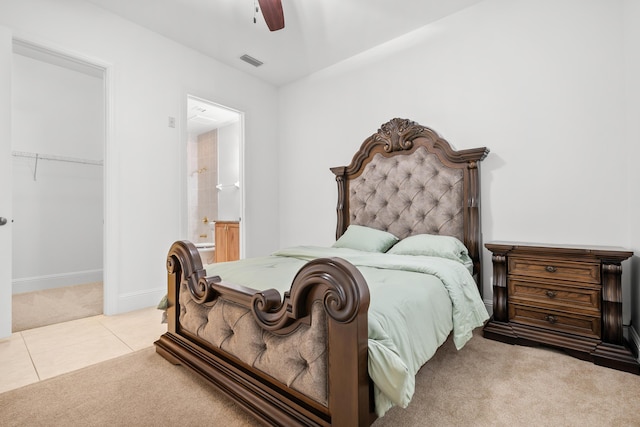 tiled bedroom featuring carpet, a closet, a ceiling fan, connected bathroom, and baseboards