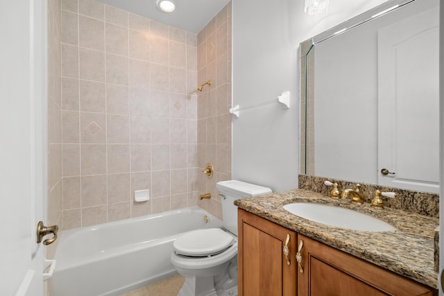 bathroom featuring toilet,  shower combination, vanity, and tile patterned flooring
