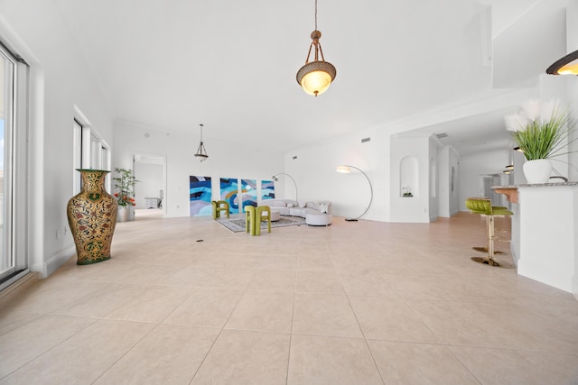 living area with tile patterned floors