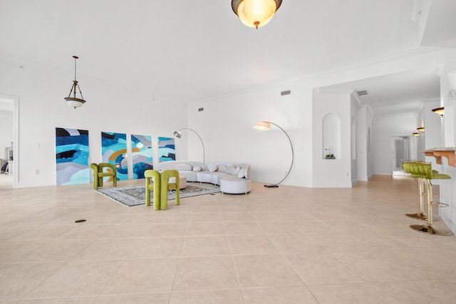 tiled living room with ornamental molding